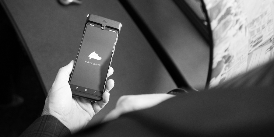 SafeCase and encased smartphone in person's hand